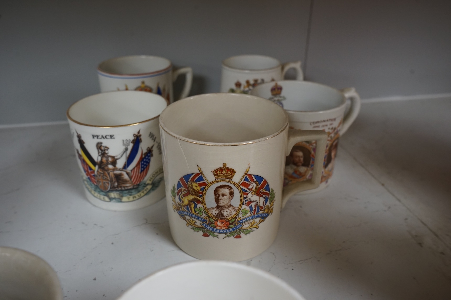 A lithophane commemorative mug and ten others to include George VI and Elizabeth coronation 1937, largest 9.5cm high